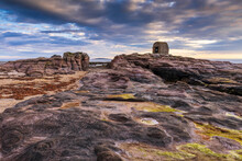 The Powder House At Seahouses On The Northumberland Coast, With A Dramatic Morning Sky.