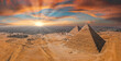 Magical sunset over the Egyptian pyramids. Aerial view of the Pyramids of Giza in Egypt.