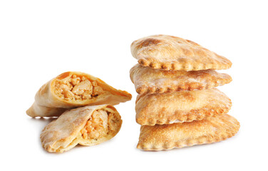 Wall Mural - Stack of baked meat empanadas on white background