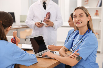 Sticker - Portrait of young intern wearing uniform on lecture in university