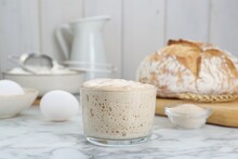 Glass Jar With Sourdough On White Marble Table