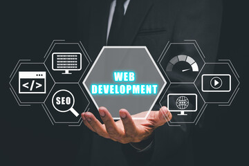 Wall Mural - web development coding programming internet technology business concept, businessman hand holding we