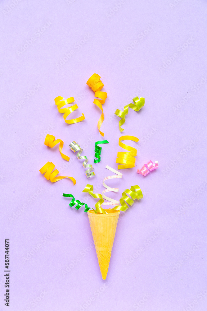 Composition with ice cream cone on lilac background