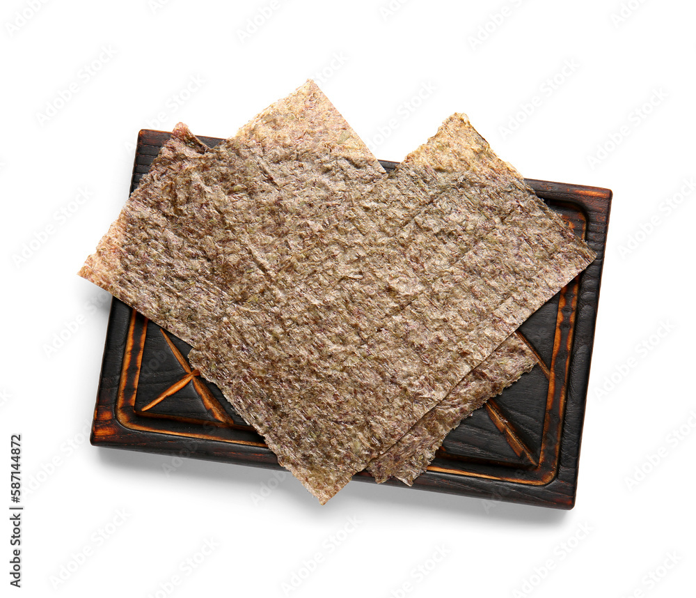 Wooden board with natural nori sheets isolated on white background