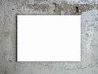 A white blank rectangle picture frame or empty square artist canvas space hanging on grunge concrete wall background.