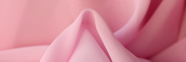 Cotton synthetic fabric in soft pink color closeup