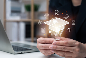 Elearning graduate certificate program concept, businessman hand holding light bulb with Internet education course degree, study knowledge, creative thinking idea, problem solving solution, AI.