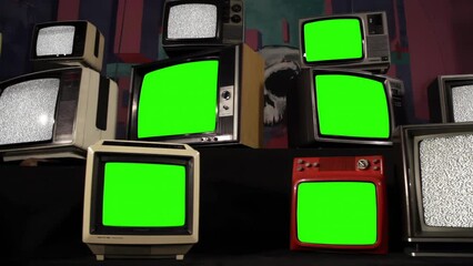 Wall Mural - vintage televisions turning on green screens and static noise. you can replace green screen with the