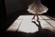 young flowergirl twirling in dress ini sunlight