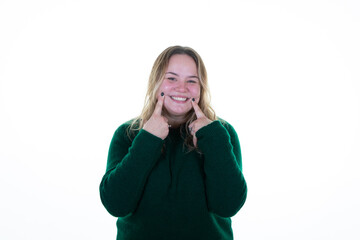 Sticker - oversize model blond smiling woman fingers on cheeks and lips to smile portrait on white background