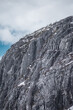 Vertical shot of a rocky mountain covered in white snow in Ile Perrot in Quebec, Canada