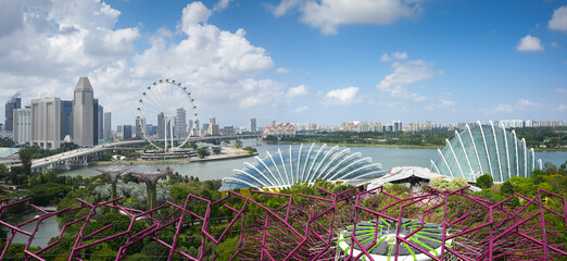 Wall Mural - Landscape of Singapore. Beautiful panoramic wide angle view with the wheel of Singapore and main landmarks from Gardens by the Bay, 2023.