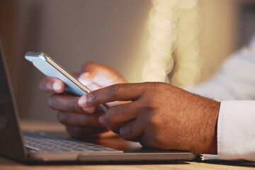 Canvas Print - Business man, hands and phone by a laptop typing a message for work networking. Hand closeup, bokeh and online management of a employee working and planning a job schedule with technology and email