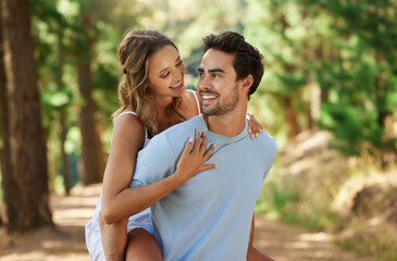 Wall Mural - Couple in nature park, piggy back and happy relationship with love and trust, travel and adventure outside. Young people in forest, outdoor and happiness together with smile, commitment and hug