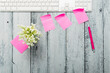 loft style place of work with lily of the valley and pink post its, directly above