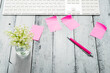 loft style place of work with lily of the valley and pink post its