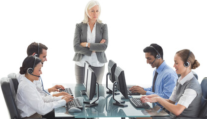 Wall Mural - Unhappy businesswoman monitoring her colleagues 