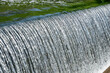 An expanse of sparkling water cascading over a weir.
