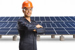 © Ljupco Smokovski - Worker wearing a helmet and uniform and posing at a solar farm