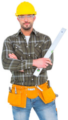 Wall Mural - Manual worker holding spirit level with arms crossed