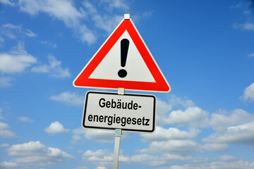 Hamburg, Germany - March 31, 2023: Traffic warning sign saying Buildings Energy Act (GebÃ¤udeenergiegesetz) - it symbolizes the controversial law in Germany