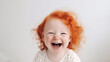 © lanych - Cute little redhead baby girl laughing closeup. Generative AI