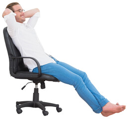 Smiling man with hands behind head while sitting on armchair 