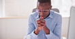 © Andrey Popov - African American Man Praying