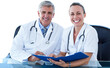 © vectorfusionart - Smiling male and female doctors with clipboard