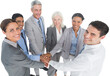 Portrait of business people piling up their hands together