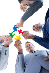 Poster - Business colleagues holding piece of puzzle