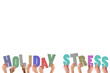 Colorful alphabet spelling holiday stress held up by people 