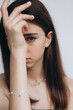 © Ananass - stylish portrait of a young 15-year-old model girl with natural light in a spacious photo studio