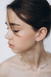 © Ananass - stylish portrait of a young 15-year-old model girl with natural light in a spacious photo studio