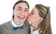 Pretty geeky hipster giving boyfriend kiss on the cheek