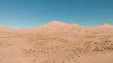 Aerial Drone Footage At Kelso Sand Dunes In The Mojave National Preserve Desert Moving Backward. Kelso, California.