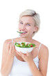 © vectorfusionart - Beautiful blonde woman eating salad