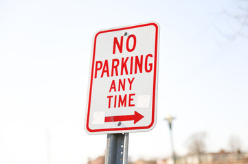 Wall Mural - No parking signs symbolize restricted parking zones to ensure safety, access, or traffic flow. They communicate that vehicles must not stop, stand, or park in the designated area.