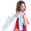 © vectorfusionart - Pretty woman holding shopping bags with finger to her lips