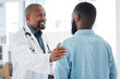 canvas print picture - Doctor, black man and touch shoulder of patient for support, comfort and empathy in hospital. Healthcare, consultation and happy medical professional talking, good news or kindness with mature person