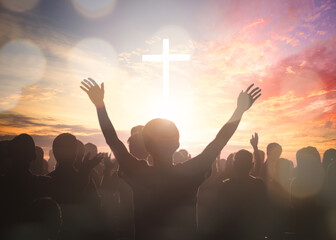 Wall Mural - easter and good friday concept, soft focus of christian worship with raised hand on white cross back