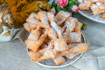 Canvas Print - Traditional Italian carnival fritters dusted with icing sugar - frappe or chiacchiere