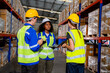 © FotoArtist - Warehouse workers checking the inventory. Products on inventory shelves storage. .Worker Doing Inventory in Warehouse. Dispatcher in uniform making inventory in storehouse. supply chain concept