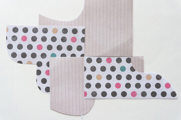 Poster - cut scrapbook paper shapes with distinct wavy forms and patterns on blank paper