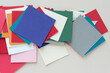 paper notes cards layered and abstractly arranged on blank paper