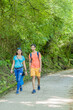 © Sangiao_Photography - mixed race couple trekking in senda del oso, Asturias. Mid adult ecotourism in Proaza
