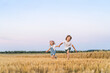 © Надежда Урюпина - Happy and free people, children run through the beveled field of wheat