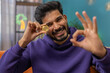 Indian man freelancer holding gold coin successful developer programmer. Ok. Hindu guy stock trader earning bitcoins after online monitoring trading operations. Increasing wealth financial prosperity