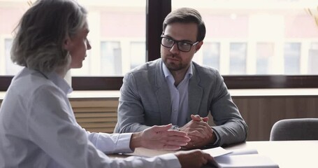 Poster - Two colleagues, business partner met in office, share opinion, learn contract details, discuss joint project, analyze report data, plan strategy sit at desk at workplace. Communication, formal meeting