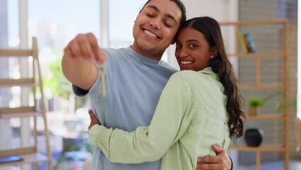 Wall Mural - Keys, new house and face of couple kiss in home, real estate and property loan for relocation. Portrait of happy man, woman and partner celebrate moving in together, building mortgage and investment